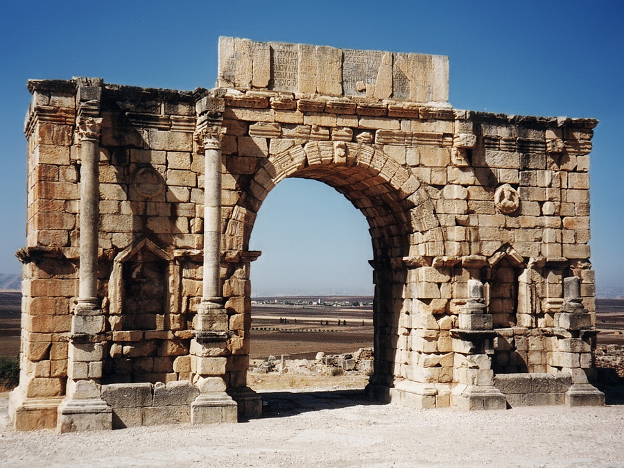 Volubilis - Triumphal arch Volubilis is a Roman site that is situated 30km outside of Meknes. The most striking monument is the triumphal arch in the main street, the Decumanus Maximus. Stefan Cruysberghs